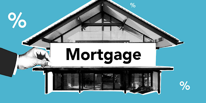Hand placing a Mortgage sign on a modern house cutout with percentage symbols on a blue background.